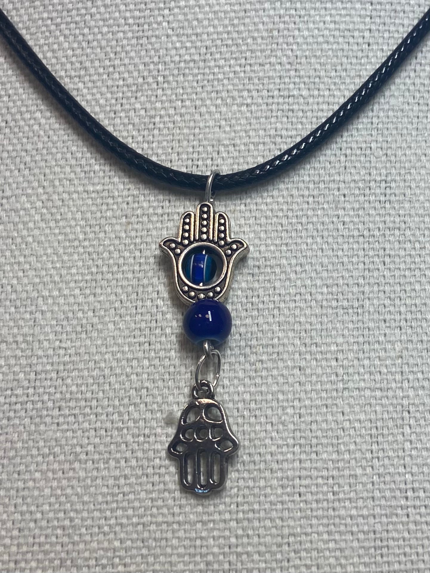 Necklace evil eye with hand